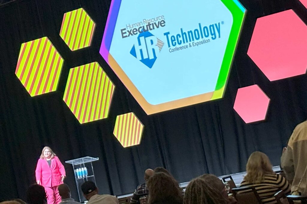 Stacey harris on stage at hr tech.jpg