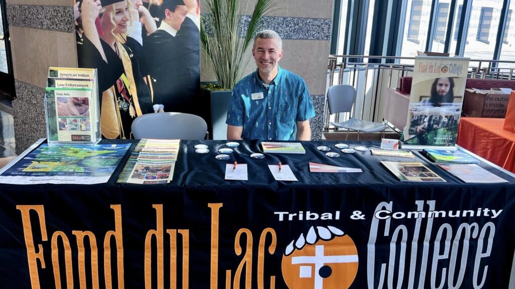 Growing college fair serves Native American students, shows a path to higher education 0ebaa2 20241021 A Man Sits At A Booth 2000.jpg