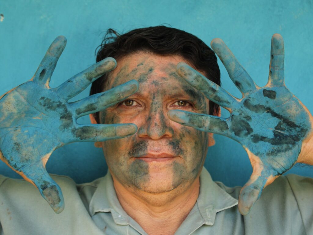 Luis May Ku 49 Poses With His Hands Painted In Maya Blue Outside His Home In Dzan Yucatan Mexico On.jpeg