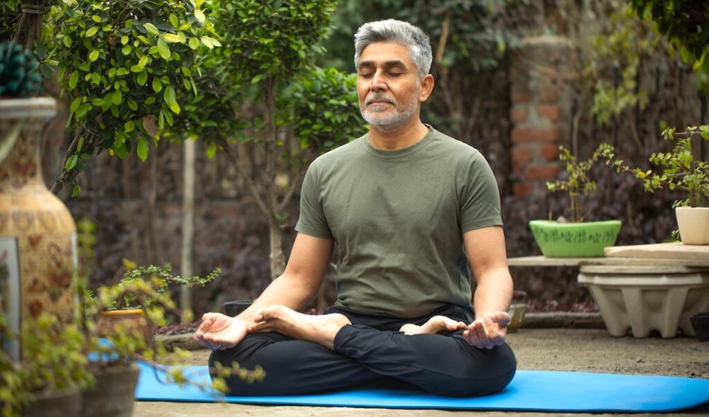 Meditation could slow aging and reduce stress, study finds Older man meditating.jpg
