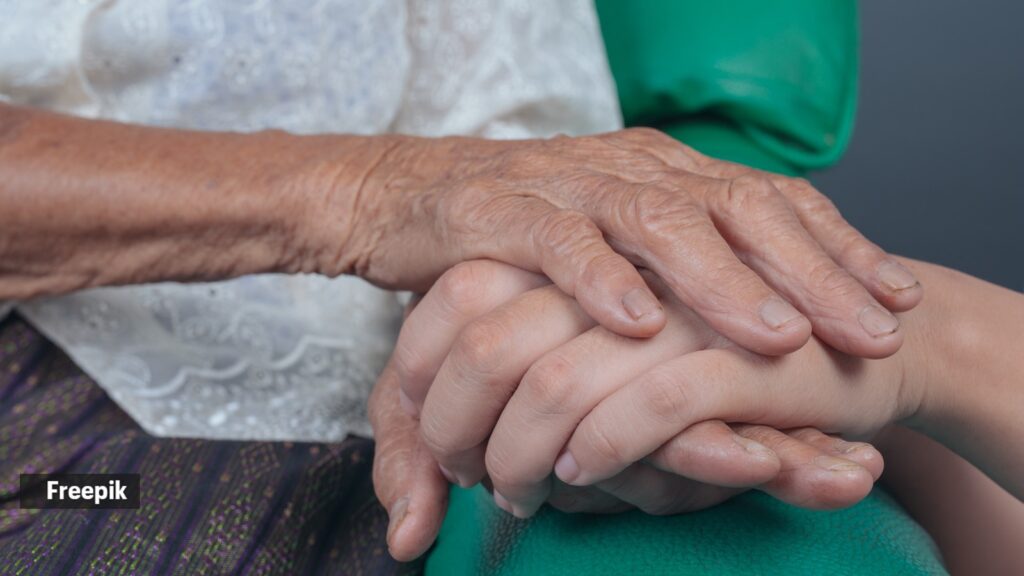 Dementia risk depends on more than lifestyle factors — overstating this can cause stigma, blame | Health News Young woman holding elderly woman s hand.jpg