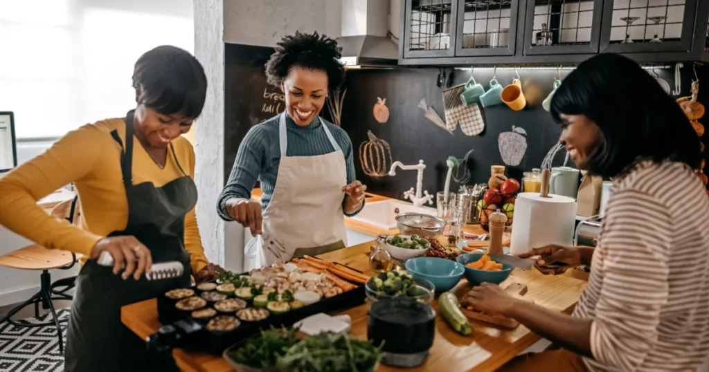 Three woman preparing food kitchen 2000x1333.jpg.webp.webp