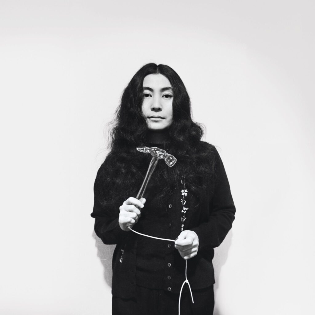 Yoko ono with glass hammer 1967. © yoko ono. photo by and © clay perry scaled.jpg