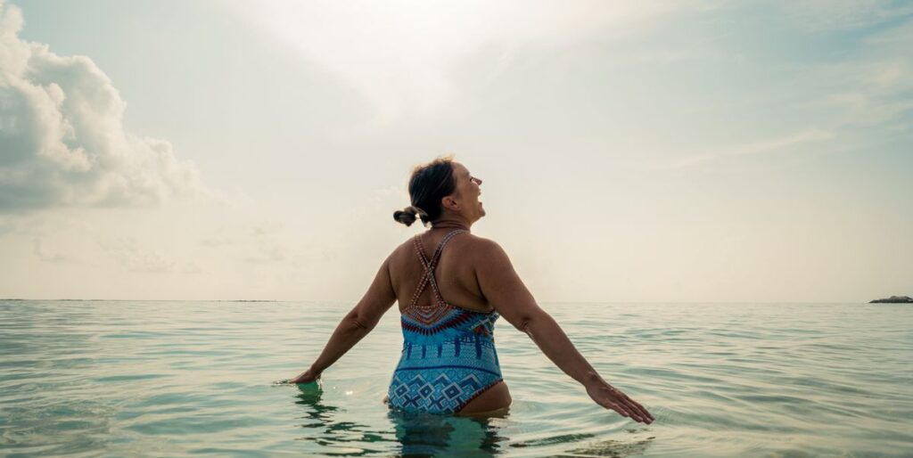 Three Habits Lower Diabetes Risk by 31 Percent, Study Finds Middle age woman standing in the ocean royalty free image 1756485458.pjpeg .jpeg
