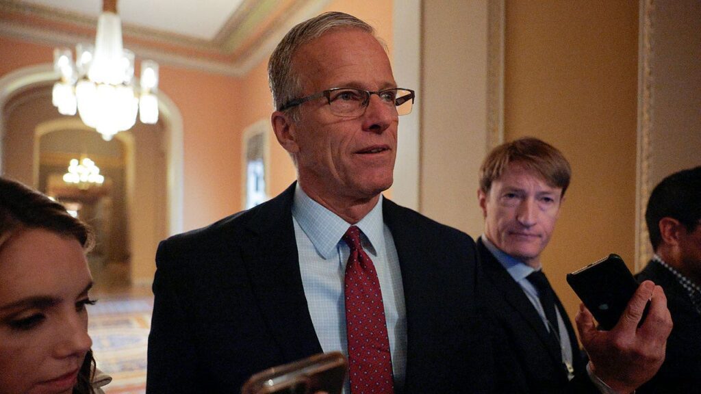 Thune speaking reporters.jpg