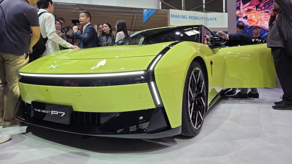 108195426 1757328127105 xpeng ceo with car.jpg