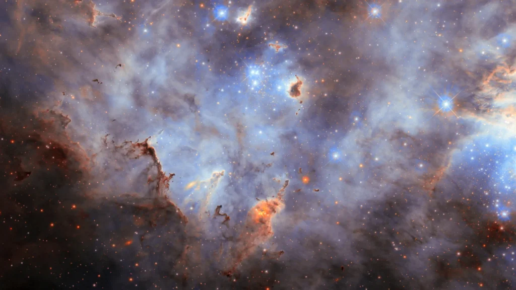 Hubble just captured a glittering star cluster like no other Cloudy starscape large magellanic cloud.webp.webp