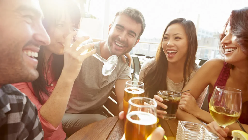 Friends drinking at outdoor rooftop bar.webp.webp