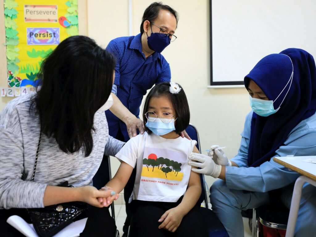 Could COVID-19 mRNA vaccines also fight cancer? | Drugs News 2022 01 07t062323z 800440906 rc22ur9kcn1l rtrmadp 3 health coronavirus indonesia.jpg