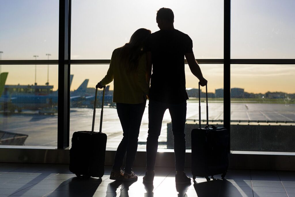Couple waiting at airport 100825 77368e5f8a9e4729b78c8d6389eb3aae.jpg