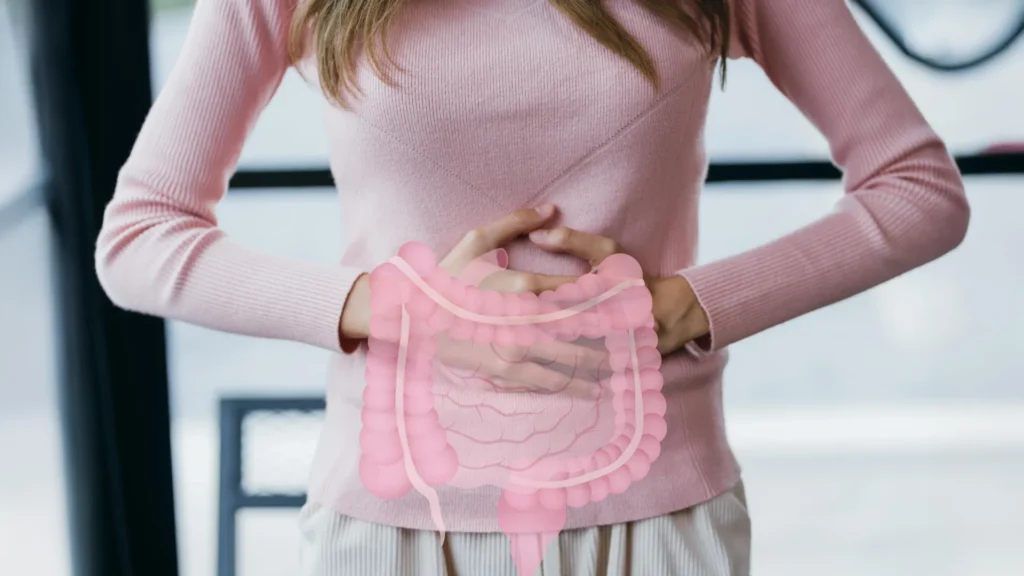 Woman holding stomach digestive gut health.webp.webp